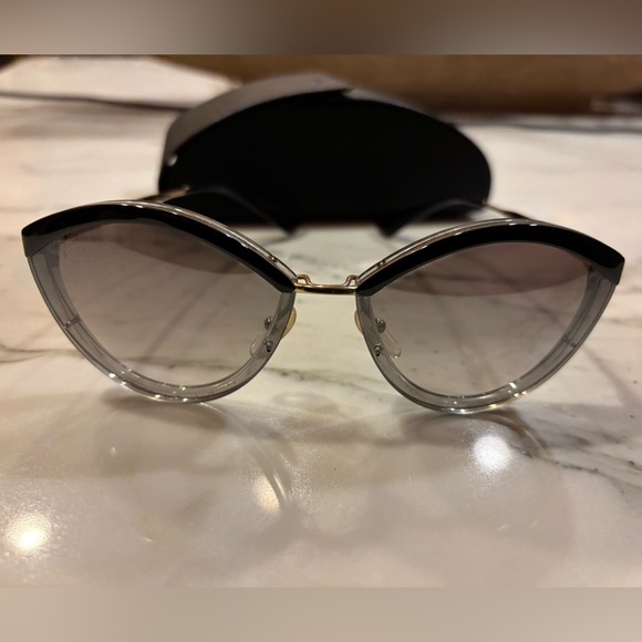 Prada SPR 07U in color code U43-5O0 is a pair of women's 